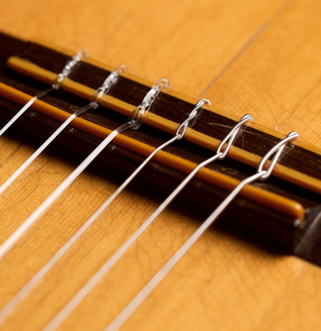 The bridge and saddle of a 1951 Hermann Hauser I (ex John DeRose) made with spruce and CSA rosewood