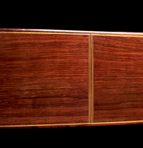 The side of a 1939 Hermann Hauser I classical guitar made with spruce and CSA rosewood.