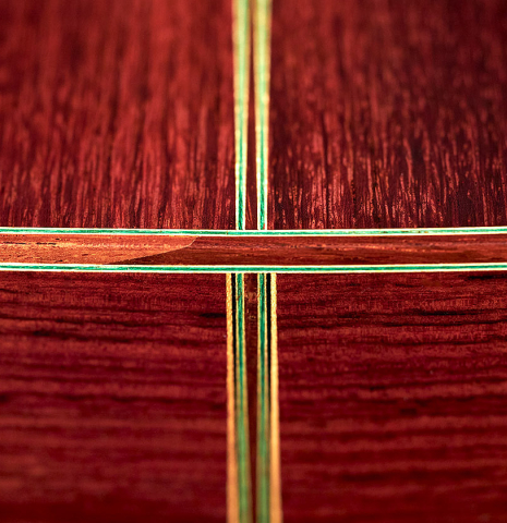The back and inlay of a 1995 Hermann Hauser III classical guitar made with spruce and Indian rosewood