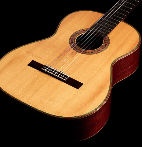 The front of a 1995 Hermann Hauser III classical guitar made with spruce and Indian rosewood
