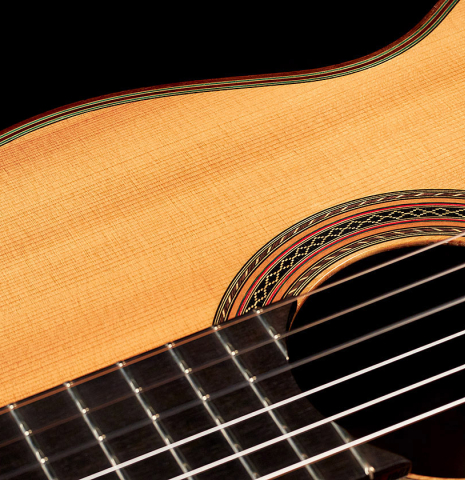 The soundboard and rosette of a 1995 Hermann Hauser III classical guitar made with spruce and Indian rosewood