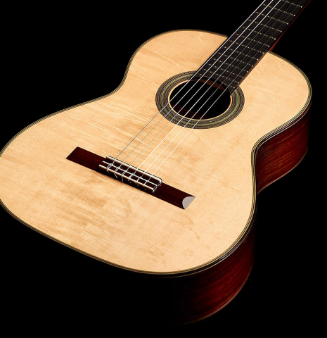 The front of a 2022 Kathrin Hauser &quot;Segovia&quot; classical guitar made of spruce and Indian rosewood.