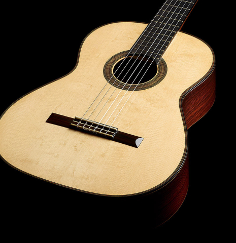 The soundboard and sides of a 2019 Kathrin Hauser "Segovia" classical guitar made of spruce and Indian rosewood.