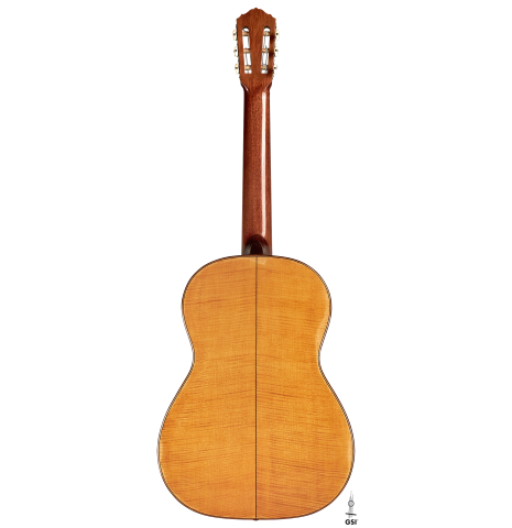 This is the back of a 1927 Hermann Hauser I classical guitar made with spruce for the soundboard and maple for the back and sides on a white background.