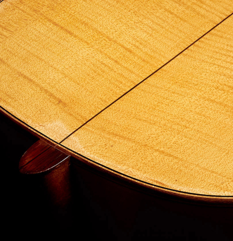 This is a closeup of the back and heel of a 1927 Hermann Hauser I classical guitar made with spruce for the soundboard and maple for the back and sides.