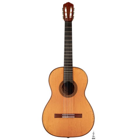 This is the front of a 1927 Hermann Hauser I classical guitar made with spruce for the soundboard and maple for the back and sides on a white background.