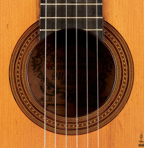 This is the label of a 1927 Hermann Hauser I classical guitar made with spruce for the soundboard and maple for the back and sides.