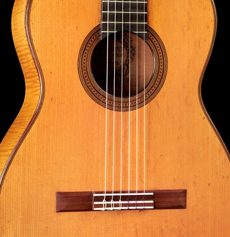 This is the front of a 1927 Hermann Hauser I classical guitar made with spruce for the soundboard and maple for the back and sides.