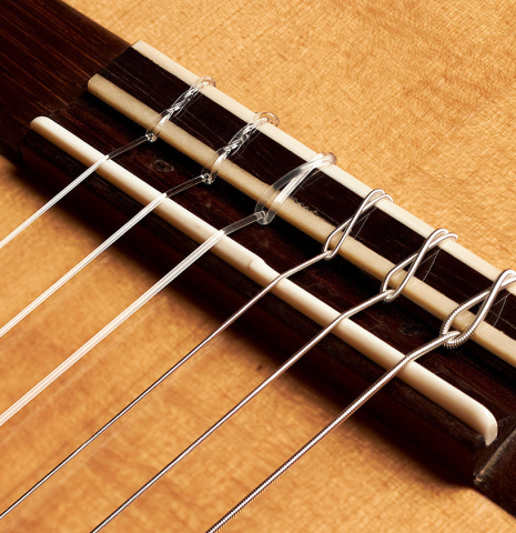 The bridge, tie-block and saddle of a 1952 Hermann Hauser I SP/CSAR (ex Sergio Abreu) made with spruce and CSA rosewood