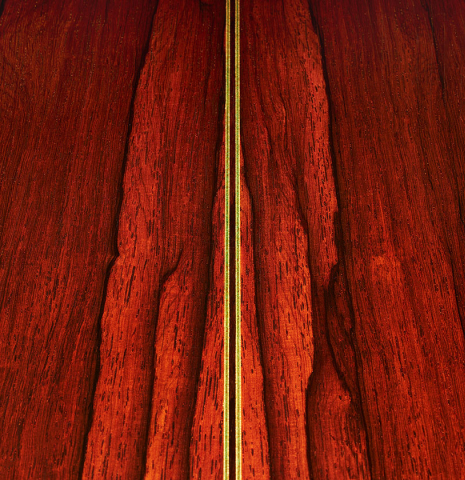 The back center seam purflings of a 2005 Hermann Hauser III classical guitar made of spruce and CSA rosewood