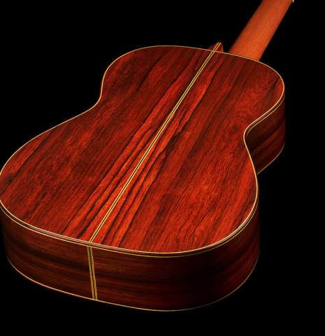 The back and sides at the foot of a 2005 Hermann Hauser III classical guitar made of spruce and CSA rosewood