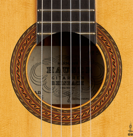 The rosette of a 2005 Hermann Hauser III classical guitar made of spruce and CSA rosewood