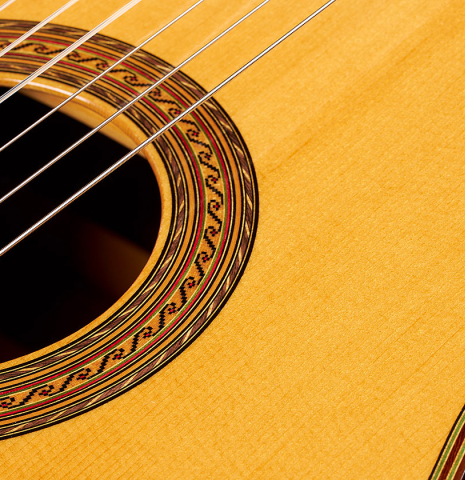 The top and rosette of a 2005 Hermann Hauser III classical guitar made of spruce and CSA rosewood