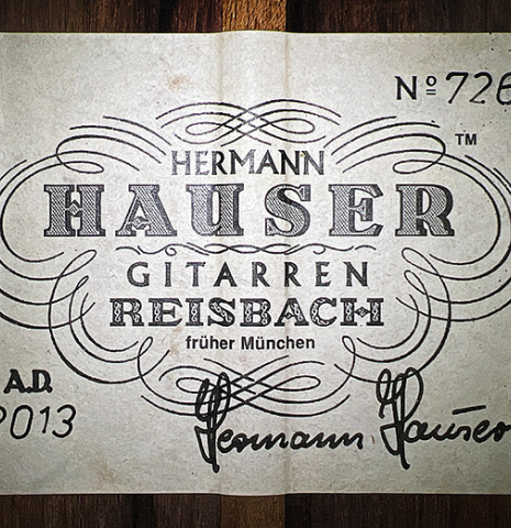 The label of a 2013 Hermann Hauser III "Llobet" classical guitar made of spruce and CSA rosewood