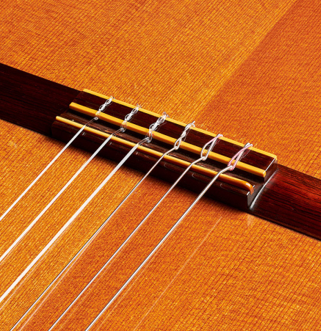 The bridge, tie-block and saddle of a 1969 Hermann Hauser II (ex Pepe Romero) made of cedar and CSA rosewood