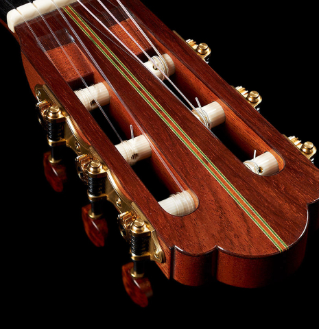 The headstock and tuning machines of a 2010 Hermann Hauser III classical guitar made of spruce and CSA rosewood