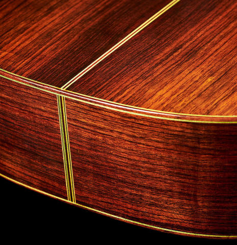 The back and sides at the foot of a 1976 Hermann Hauser II classical guitar made of spruce and Indian rosewood