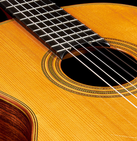 The soundboard and rosette of a 1976 Hermann Hauser II classical guitar made of spruce and Indian rosewood
