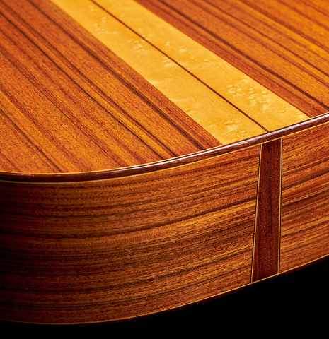 The back and sides at the foot of a 2002 Hermann Hauser III classical guitar made of spruce and pau ferro