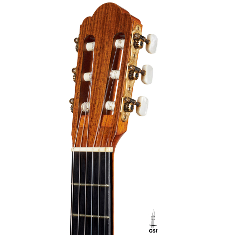 The headstock of a 2002 Hermann Hauser III classical guitar made of spruce and pau ferro