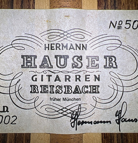 The label of a 2002 Hermann Hauser III classical guitar made of spruce and pau ferro