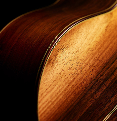 The back and bass side of a 2000 Hermann Hauser III classical guitar made of spruce and CSA rosewood