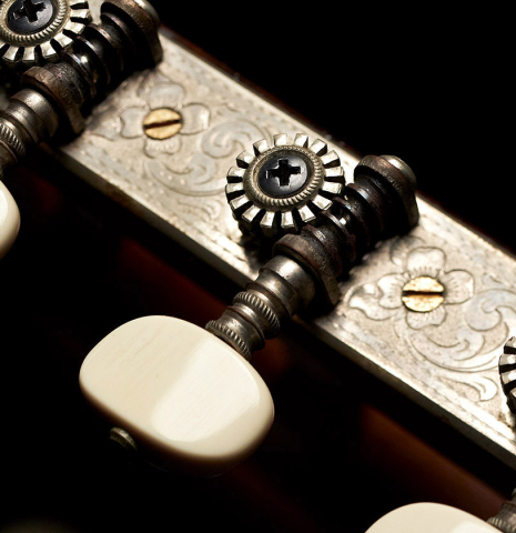 The machine heads of a 1930 Santos Hernandez Spanish vintage classical guitar made with spruce top and CSA rosewood. 