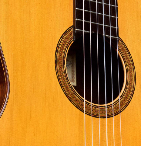 The soundboard and rosette of a 1966 Hernandez y Aguado classical guitar made of spruce and CSA rosewood