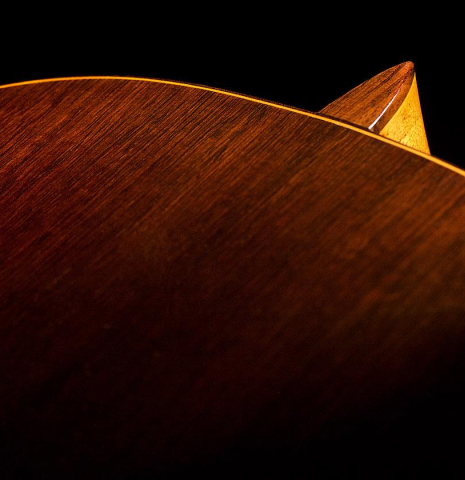 The heel, back binding and purfling of a 1966 Hernandez y Aguado classical guitar made of spruce and CSA rosewood