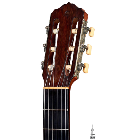 The headstock and machine heads of a 1918 Santos Hernandez classical guitar made with spruce and csa rosewood on a white background