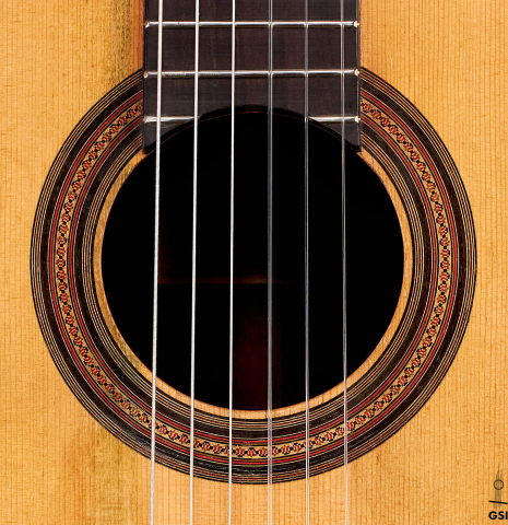The rosette of a 1918 Santos Hernandez classical guitar made with spruce and csa rosewood