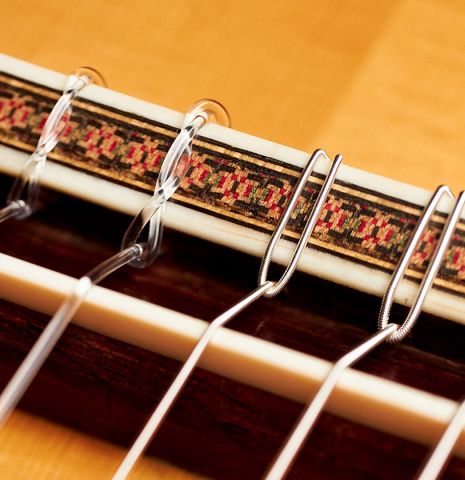 The ornamented rosette of a 1974 Hernandez y Aguado classical guitar made of spruce and CSA rosewood