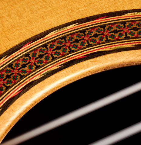 A close-up of the rosette of a 1974 Hernandez y Aguado classical guitar made of spruce and CSA rosewood