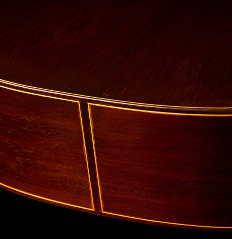 The back and sides at the foot of a 1964 Hernandez y Aguado classical guitar made of spruce and CSA rosewood