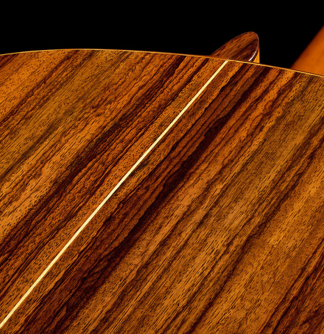 The heel and back center seam of a 1941 Santos Hernandez classical guitar made of spruce and CSA rosewood
