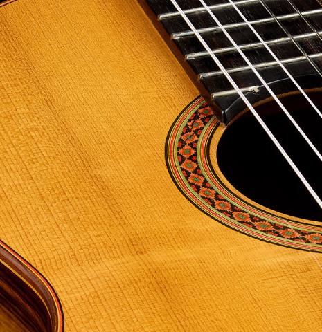 The soundboard and rosette of a 1941 Santos Hernandez classical guitar made of spruce and CSA rosewood