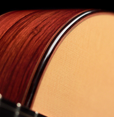 The soundboard and side of a 2022 Dietmar Heubner classical guitar made with spruce and African rosewood