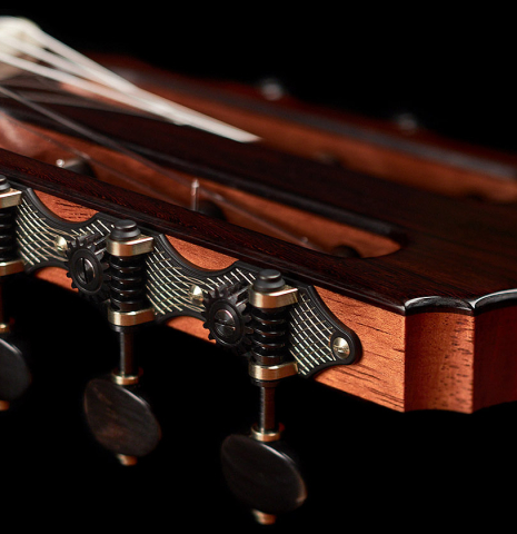 The headstock and tuners of a 2022 Dietmar Heubner classical guitar made with spruce and African rosewood