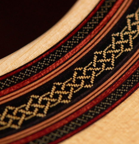 The rosette of a 2022 Dietmar Heubner classical guitar made with spruce and African rosewood
