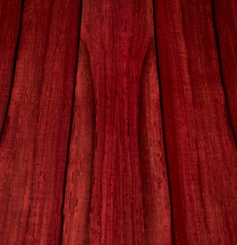 The back wood of a 2023 Dietmar Heubner classical guitar made with spruce and African rosewood