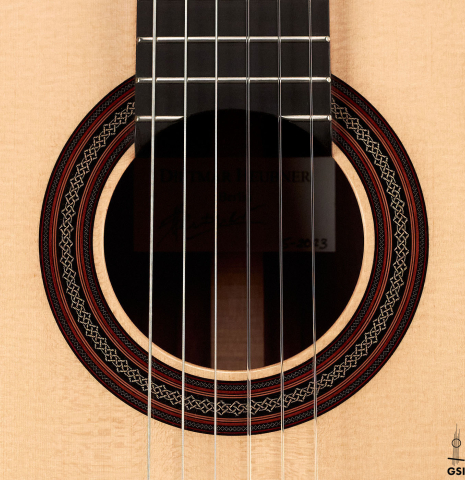The rosette of a 2023 Dietmar Heubner classical guitar made with spruce and African rosewood