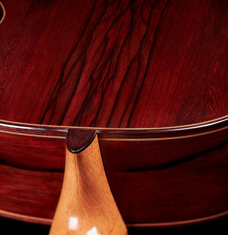 The heel and back binding of a 2024 Dietmar Heubner "Bois de Rose" classical guitar made with spruce and African rosewood