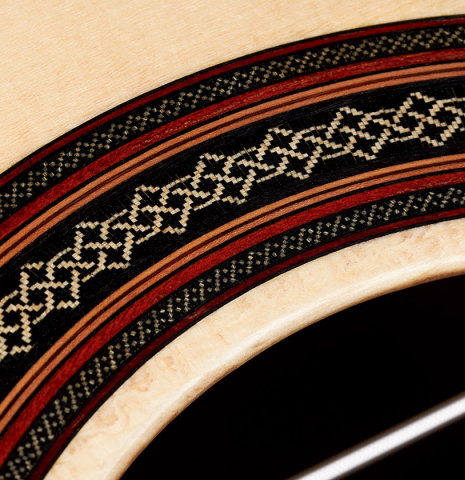 Close-up detail of the rosette of a 2024 Dietmar Heubner "Bois de Rose" classical guitar made with spruce and African rosewood