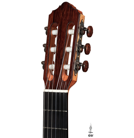 The headstock and tuners of a 2022 Dietmar Heubner classical guitar made with cedar and African rosewood