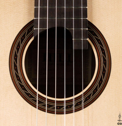 The rosette of a 2016 Kenny Hill "Performance" classical guitar made of spruce and Indian rosewood