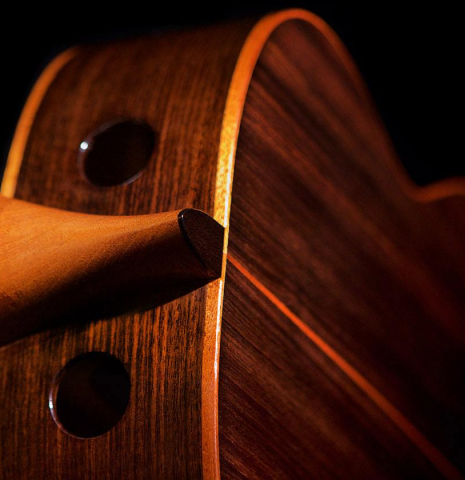 The sound ports of a 2016 Kenny Hill "Performance" classical guitar made of spruce and Indian rosewood