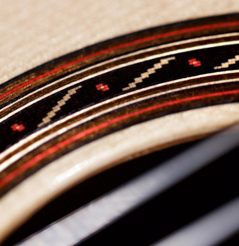 The rosette of a 2016 Kenny Hill "Performance" classical guitar made of spruce and Indian rosewood