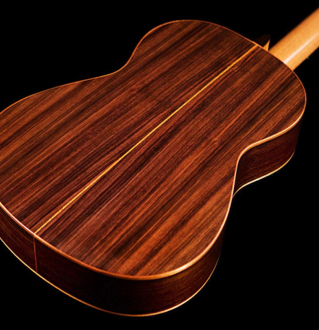 The back of a 2016 Kenny Hill "Performance" classical guitar made of spruce and Indian rosewood