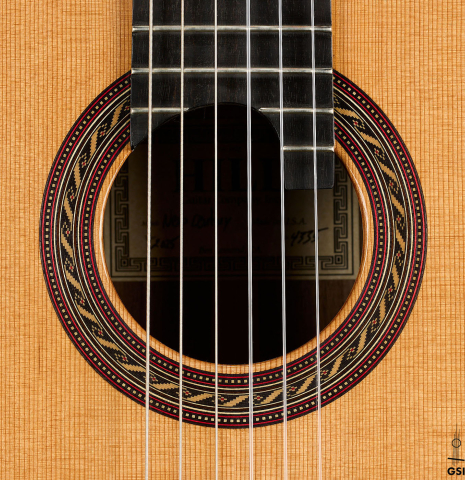 The rosette of a 2025 Kenny Hill "New Century CD/SP" classical guitar made of a cedar/spruce double-top and Indian rosewood back and sides