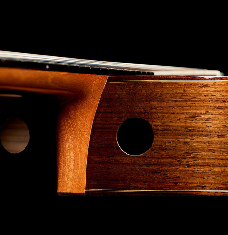 The heel, neck, fingerboard, soundports and sides of a 2025 Kenny Hill "New Century CD/SP" classical guitar made of a cedar/spruce double-top and Indian rosewood back and sides